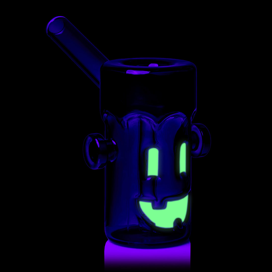 MJ Arsenal Frankenbubbler under black light, three-quarter view with the mouthpiece to the left