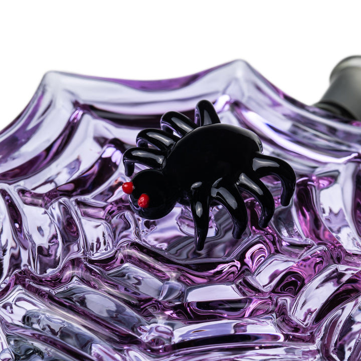 Close-up of the black sculpted spider with red eyes on the Nightcrawler Mini Dab Rig purple web