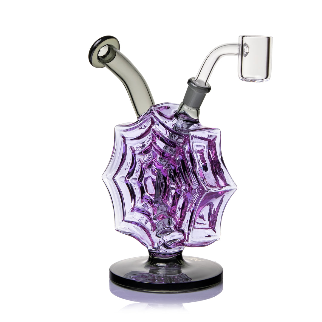 MJ Arsenal Nightcrawler Mini Dab Rig turned the other way, the smoke mouthpiece on the left and the quartz banger on the right