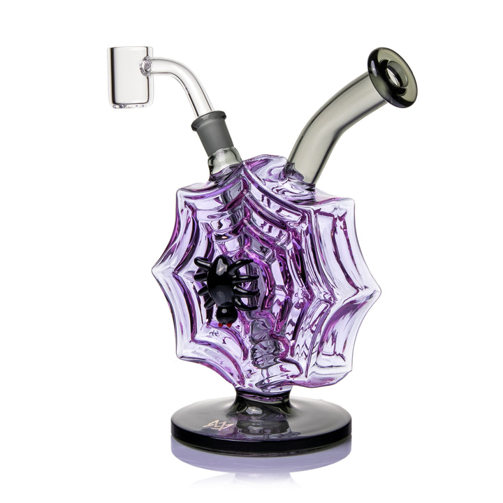 MJ Arsenal Nightcrawler Mini Dab Rig three-quarter view, the black spider on the purple web face with the banger on the left
