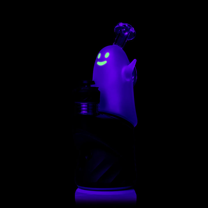MJ Arsenal Specter Peak Top glowing under black light, fitted on a Puffco Peak, side view