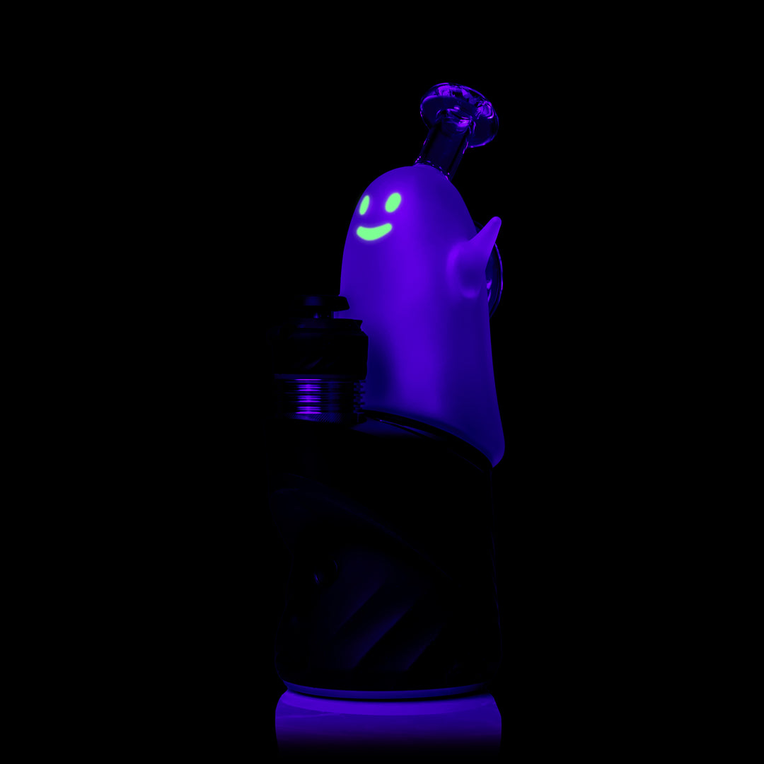 MJ Arsenal Specter Peak Top glowing under black light, fitted on a Puffco Peak, side view