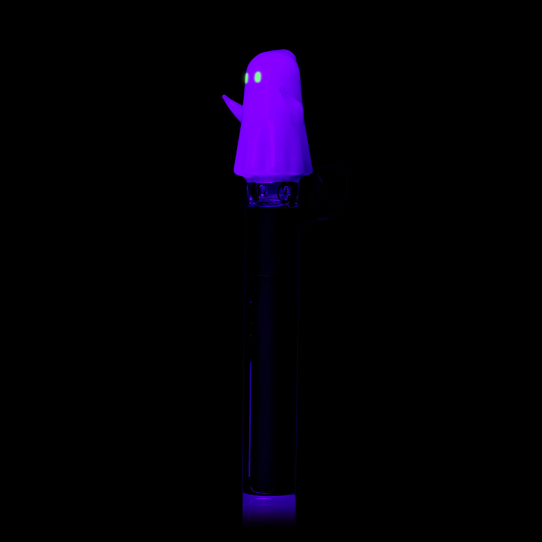 MJ Arsenal Specter Pivot Top glowing under black light, fitted on a Puffco Pivot, side view