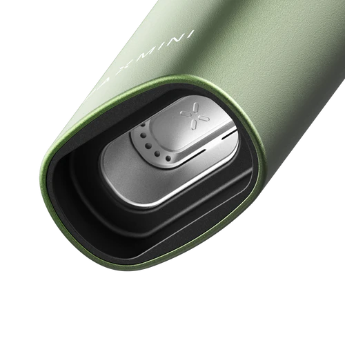 New PAX Mini dry herb vaporizer in Greenstone, open oven showing stainless steel chamber