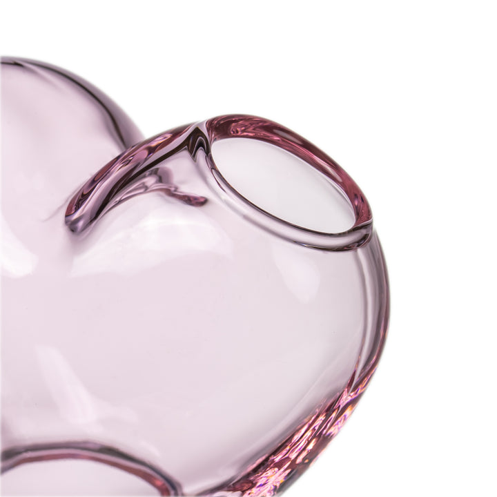 MJ Arsenal Evermore heart glass water pipe detail shot highlighting smooth borosilicate glass curves and craftsmanship