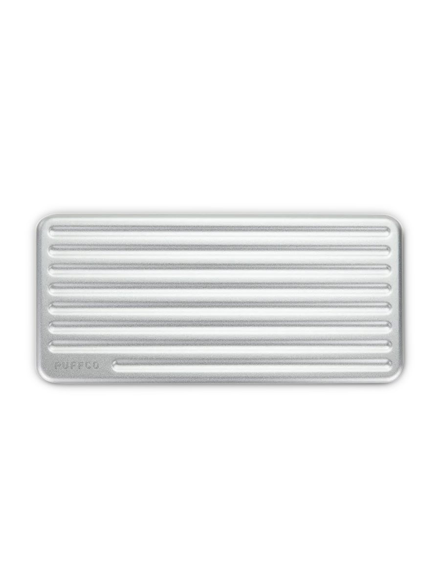 Puffco Travel Case Pearl – overhead shot showing ribbed aluminum lid and compact rectangular design.