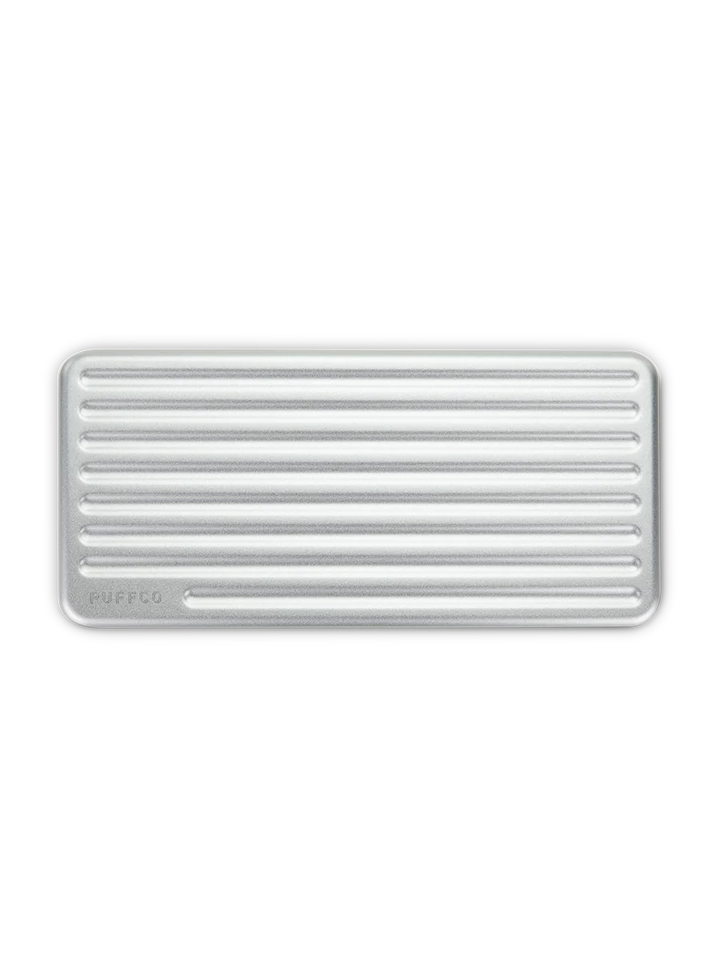 Puffco Travel Case Pearl – overhead shot showing ribbed aluminum lid and compact rectangular design.
