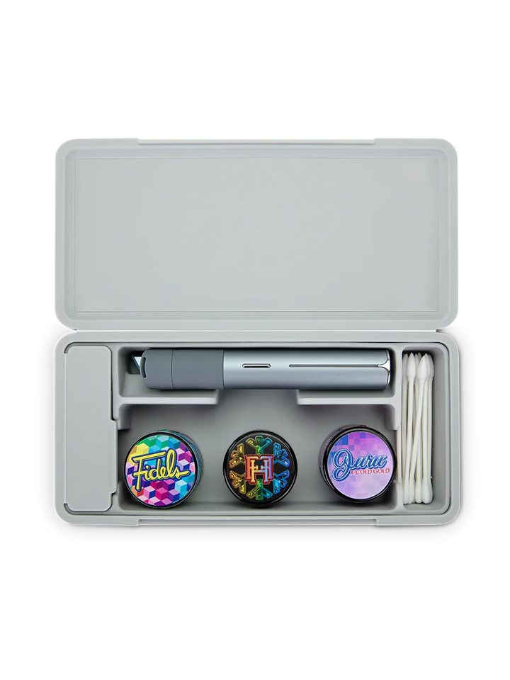 Puffco Travel Case Pearl – front open view showing silicone-lined storage for Pivot, Hot Knife, and jars.