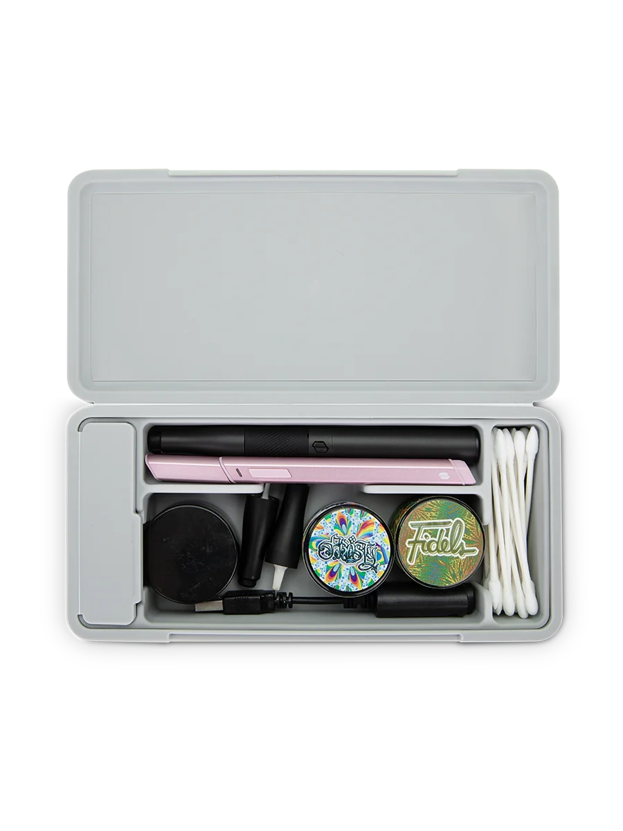 Puffco Travel Case Pearl – interior view loaded with jars, tools, and accessories for organized travel.