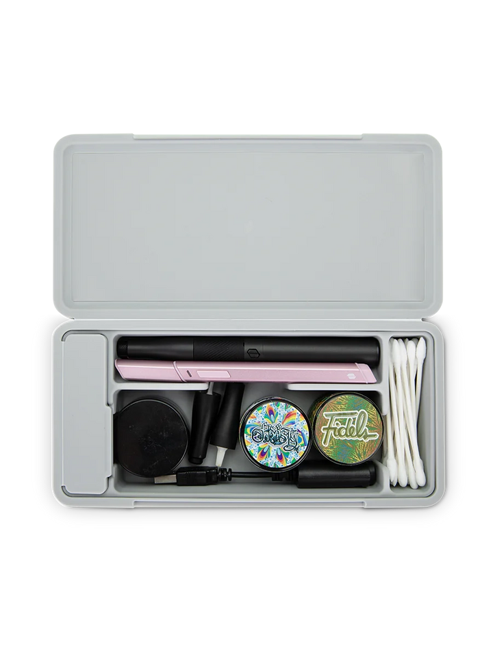 Puffco Travel Case Pearl – interior view loaded with jars, tools, and accessories for organized travel.