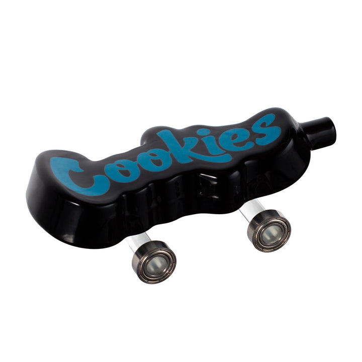 Cookies Toke Deck black skateboard-shaped hand pipe with functional wheels and single hole push bowl top view