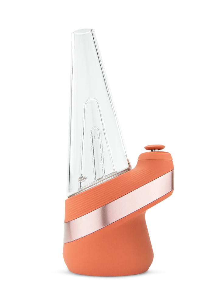 Puffco Peak in Canyon – side profile showing glass cone and matte orange base design.