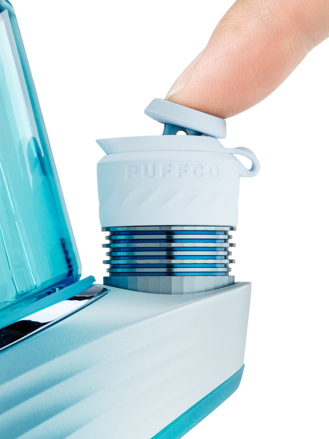 Close-up of a finger on the joystick carb cap above the 3DXL chamber on the Puffco Peak Pro in Glacier.