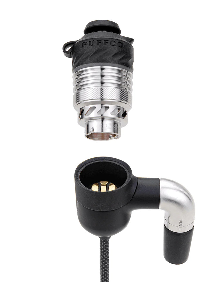 Puffco Peak Pro Link close-up of 3D chamber housing and 90-degree glass joint adapter for traditional rigs