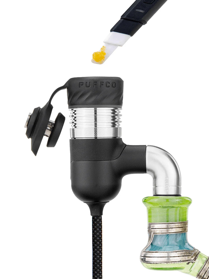 Puffco Peak Pro Link heating element attached to quartz banger on glass rig for torch-free dabbing