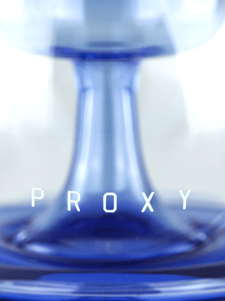 Close-up of the Puffco Proxy Ripple base with 'PROXY' branding, highlighting the ripple design in Sea color