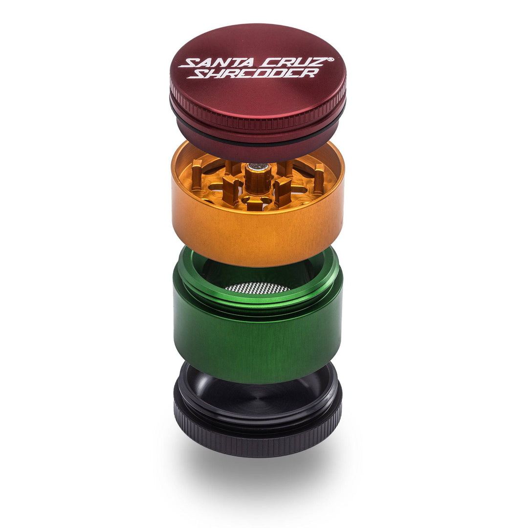 Rasta Santa Cruz Shredder 4-Piece Small Grinder – vibrant red, yellow, green tri-color finish.