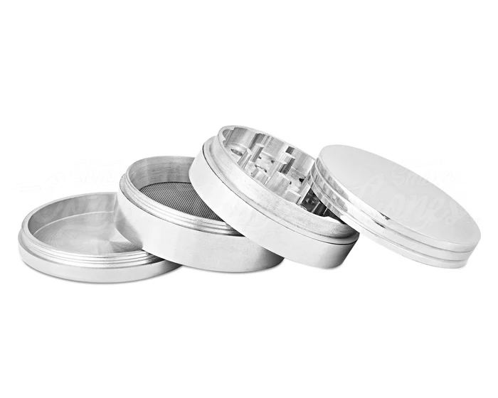 Open 4-piece aluminum grinder with parts stacked for display