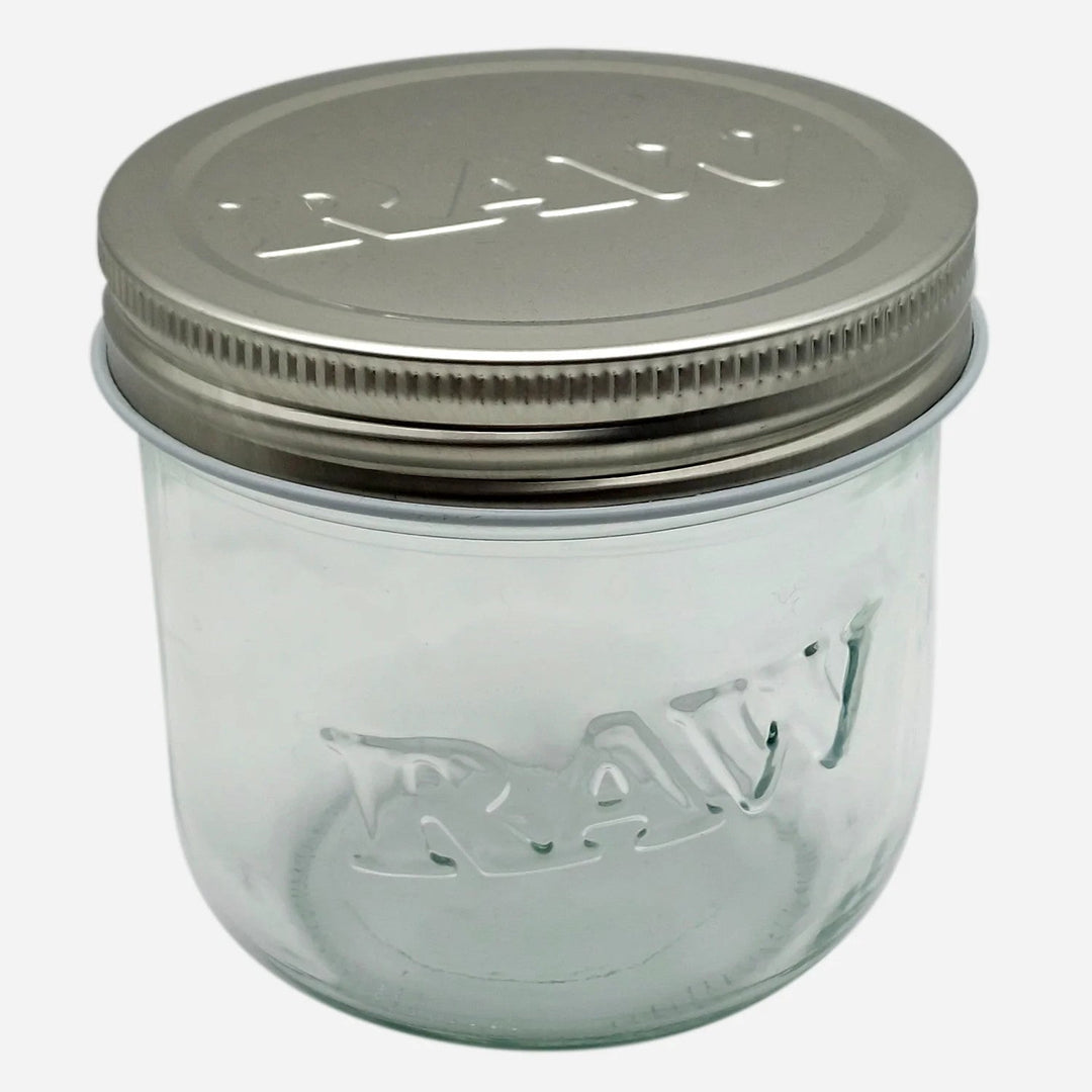 RAW 10 oz glass jar with embossed logo and metal screw-on lid, ideal for airtight and smell-proof storage of herbs or contents.
