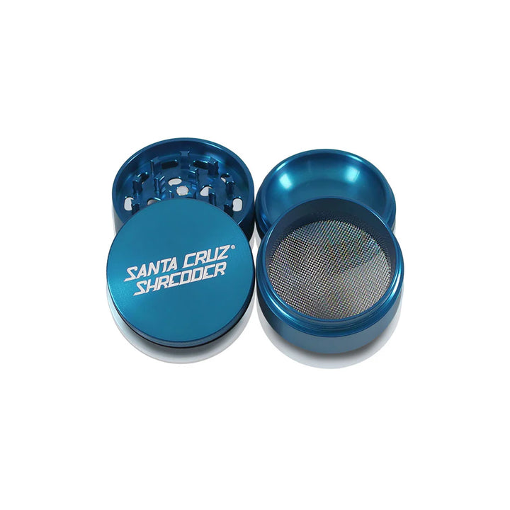 All four pieces of the Blue Santa Cruz Shredder Medium Grinder displayed flat.