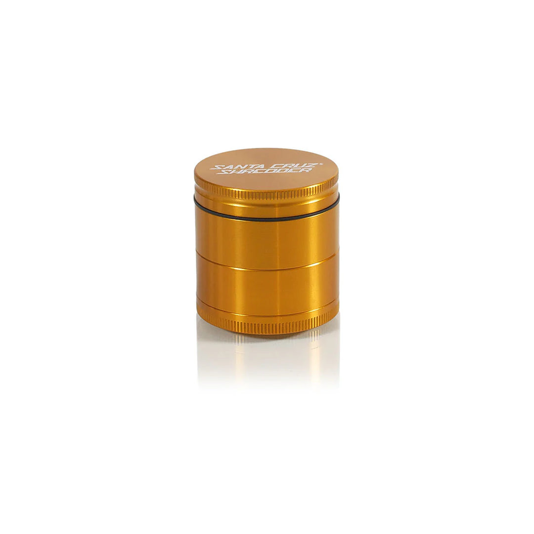 Gold Santa Cruz Shredder 4-Piece Medium Grinder – premium anodized finish with laser-etched logo.