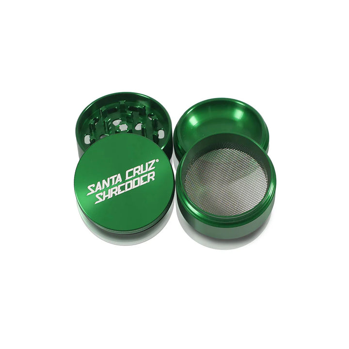 All four sections of the Green Santa Cruz Shredder 4-Piece Medium Grinder.