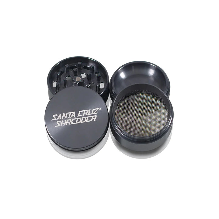 Four parts of the Grey Santa Cruz Shredder 4-Piece Medium Grinder open.