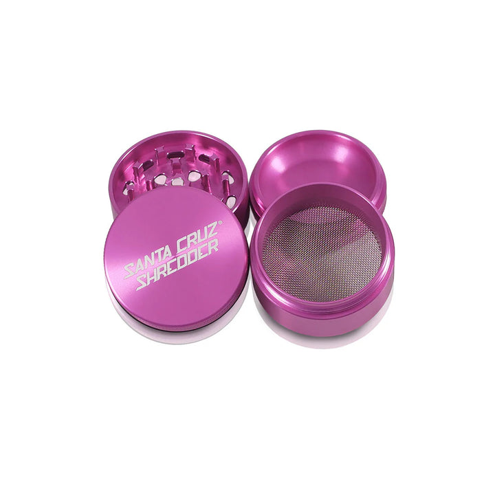 Pink Santa Cruz Shredder 4-Piece Grinder with all components separated.