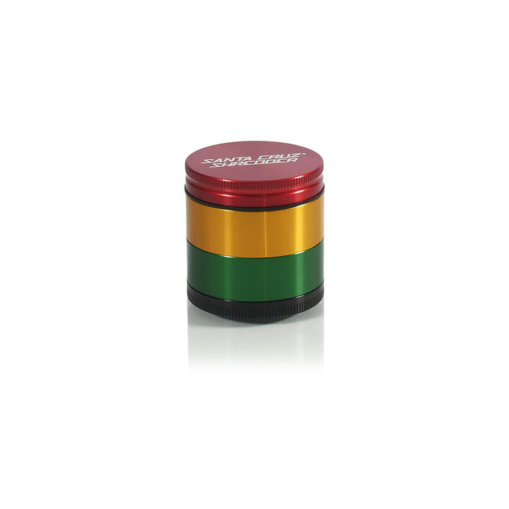 All four sections of the Rasta Santa Cruz Shredder 4-Piece Medium Grinder.