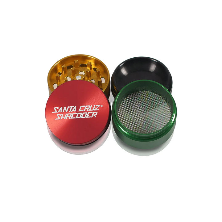 Santa Cruz Shredder Medium Rasta Grinder – 4 piece design with color blend finish.