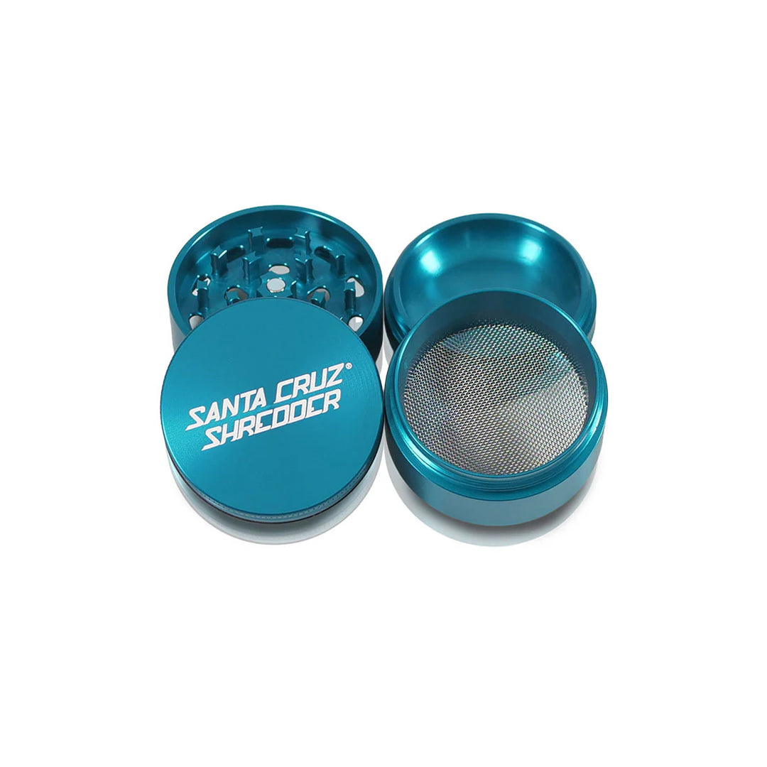 Four open parts of the Teal Santa Cruz Shredder Medium 4-Piece Grinder.