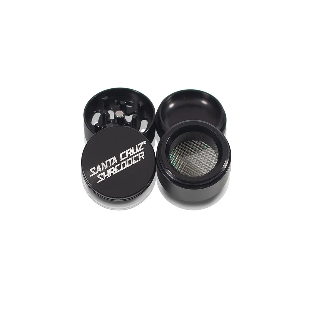 Four open pieces of the Black Santa Cruz Shredder 4-Piece Small Grinder shown side by side.