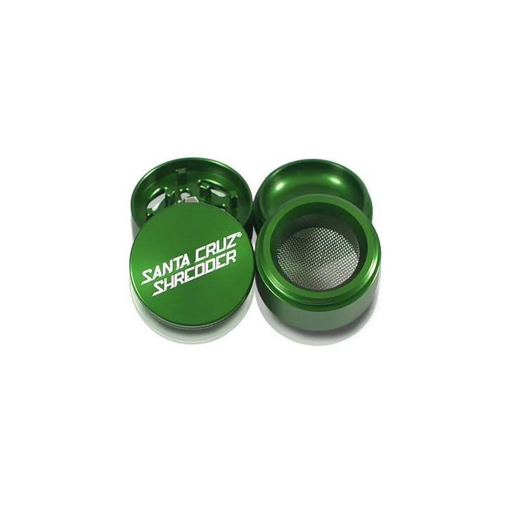 All four parts of the Green Santa Cruz Shredder Small Grinder displayed – top, teeth, screen, and base.