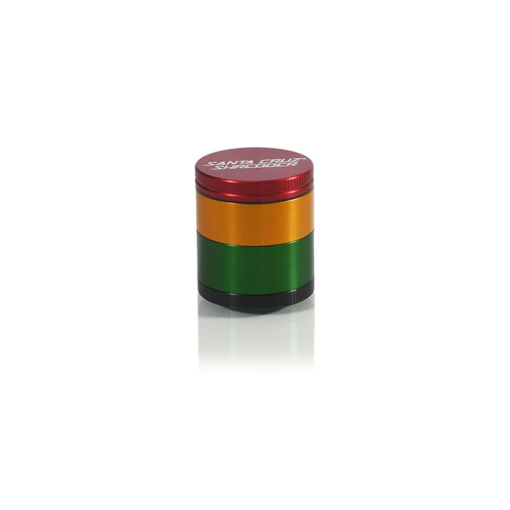 Santa Cruz Shredder Small 4-Piece Grinder in Rasta colorway – smooth anodized aluminum body.