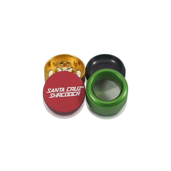 All four sections of the Rasta Santa Cruz Shredder 4-Piece Small Grinder arranged open.