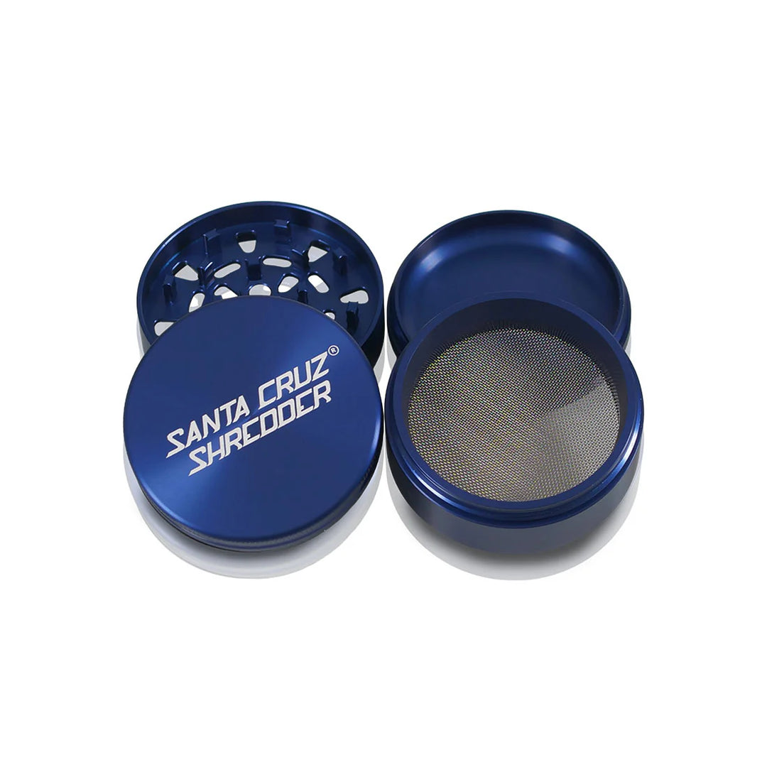 Blue Santa Cruz Shredder grinder with magnetic lid and sifter screen on white background