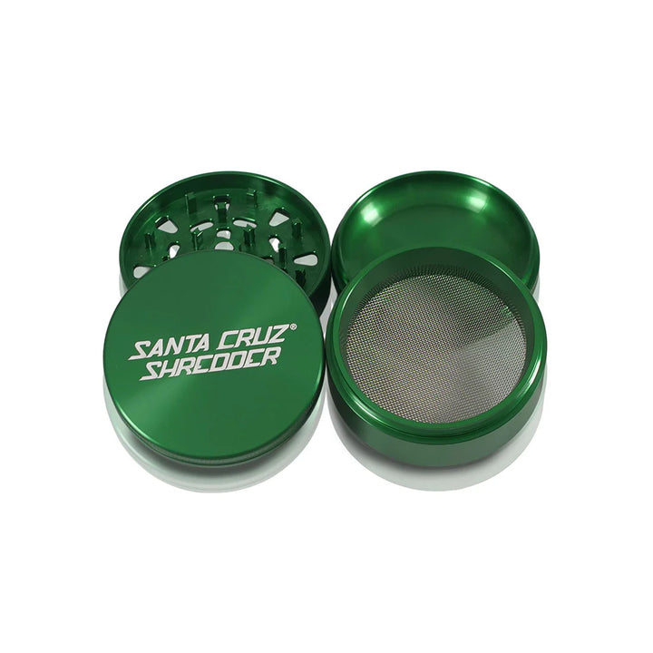 Green Santa Cruz Shredder grinder showing interior tooth geometry and screen