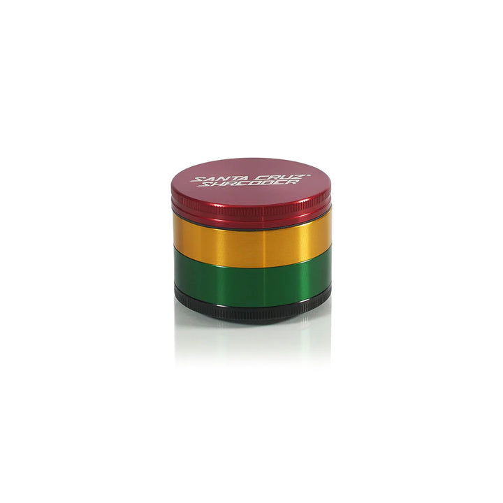 Rasta Santa Cruz Shredder grinder in red-yellow-green anodized finish with logo on lid