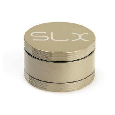 Champagne-colored SLX 4 piece grinder standing upright
