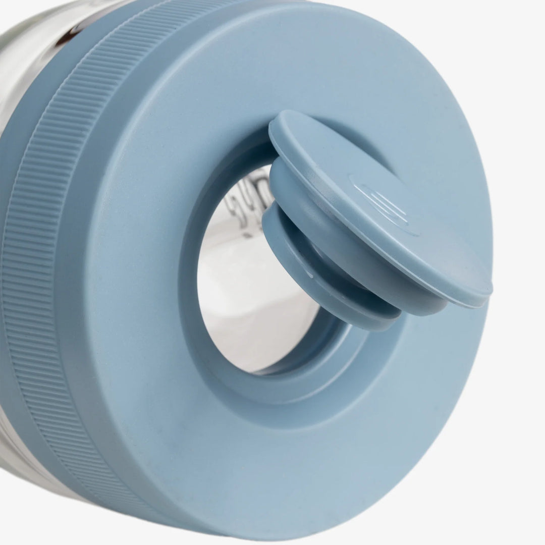 Detail of the Cerulean silicone base foot of the Softglass Core Bong showing the ribbed drop-protection ring