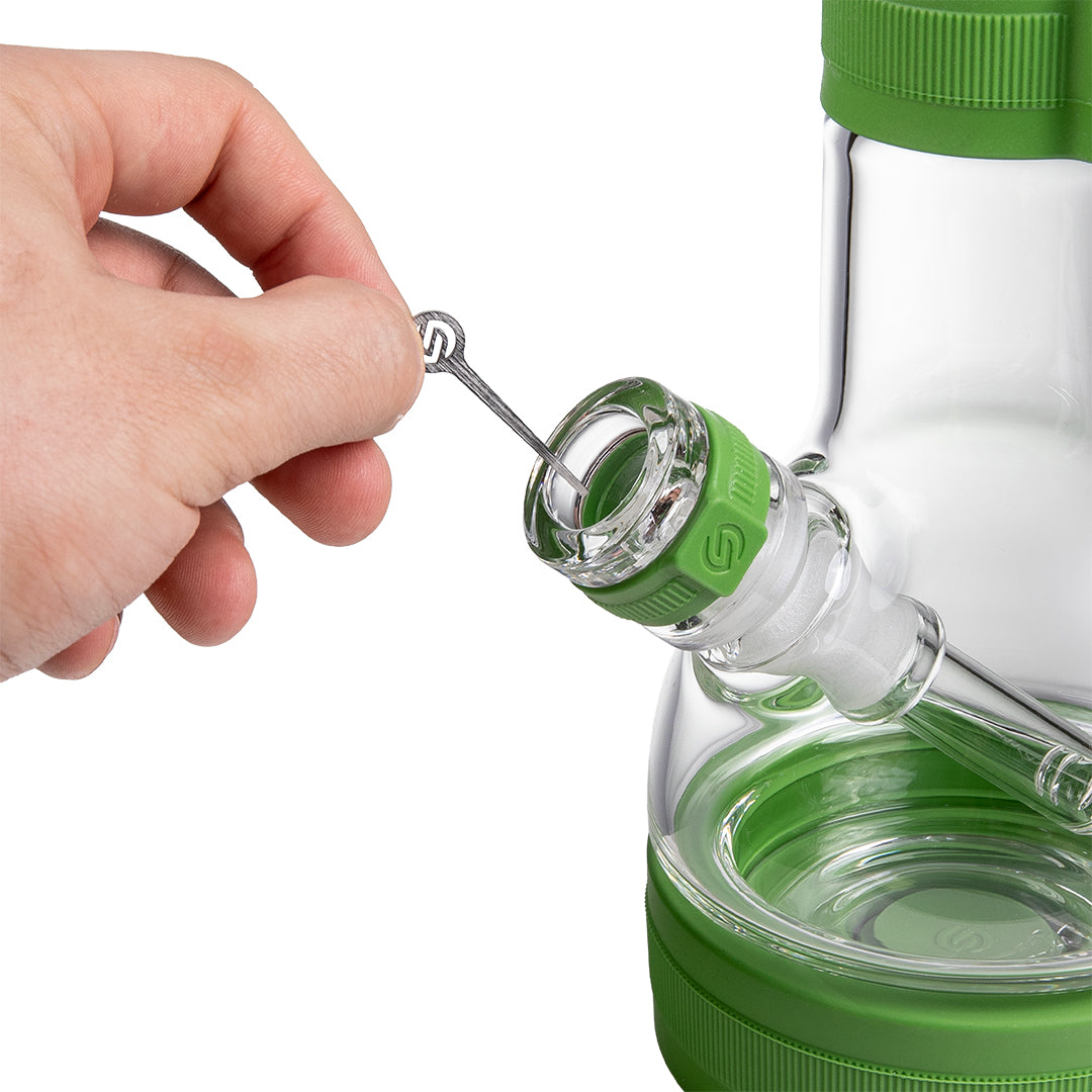 Close-up of the included Softglass metal cleaning tool stored in the slot on the Pistachio silicone neck sleeve
