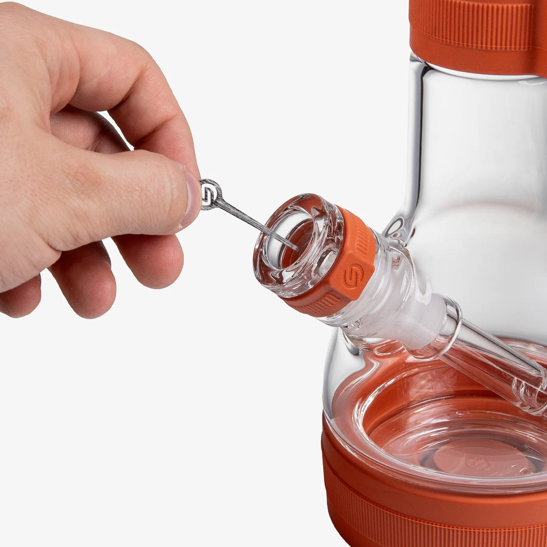 Close-up of the metal cleaning tool stored in the Sienna silicone neck sleeve