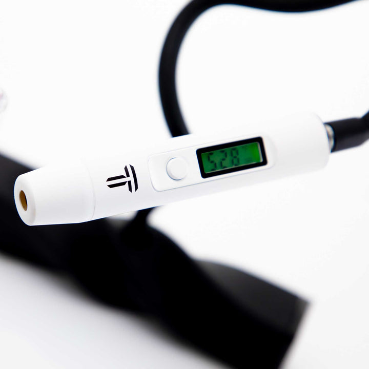Close-up of Terpometer Infrared LE White showing 528 degrees F on screen, highlighting its precision for temperature-controlled dabbing.
