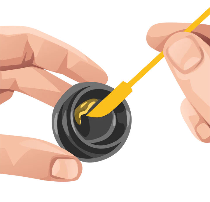 yellow silicone dabber tool being used to scoop concentrate from jar demonstrating precision control and minimal waste
