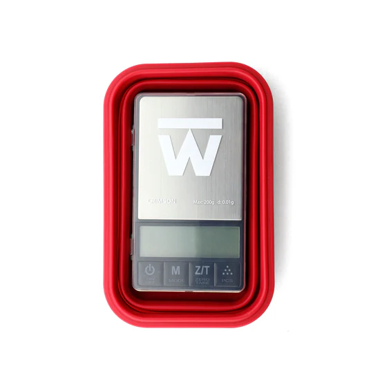 Truweigh Crimson digital scale in Red with collapsible silicone bowl closed, top view