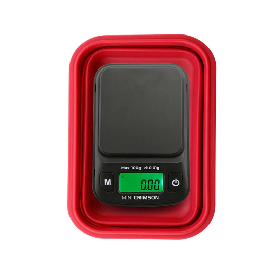Truweigh Mini Crimson digital scale in Red with collapsible silicone bowl closed, top view