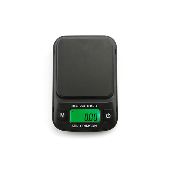 Truweigh Mini Crimson digital scale in Black top view, LCD display powered on
