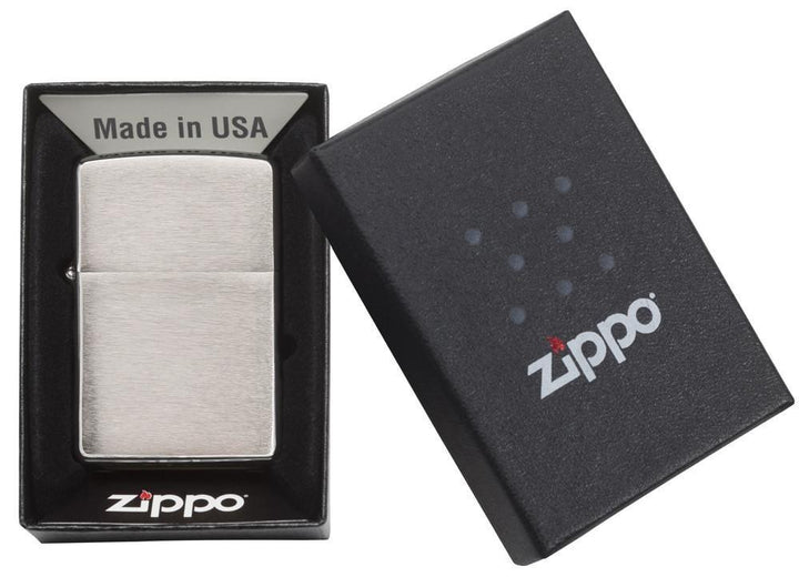 Zippo - Chrome Brushed Lighter displayed in original black gift box with Zippo logo. Windproof and refillable, made in the USA.
