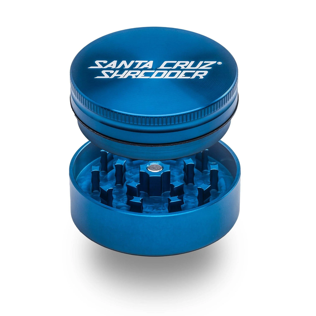 Blue Santa Cruz Shredder 2-Piece Medium Grinder – precision-cut aluminum teeth and magnetic lid shown open.