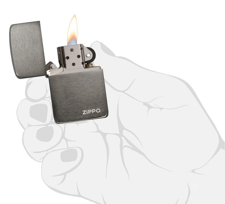 Zippo - 1941 Replica Black Ice with Zippo Logo Lighter ignited in a stylized hand illustration, showcasing its sleek windproof design and matte finish.